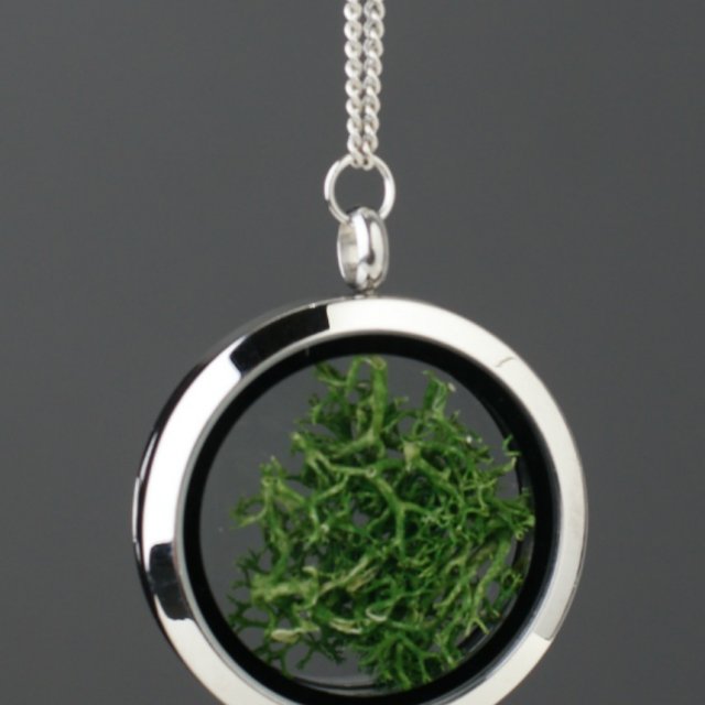 Amulet with dark green moss